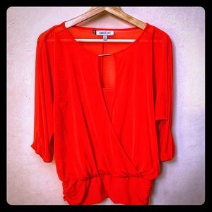 Orange blouse from JLO